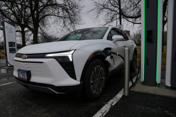 An electric vehicle charges at a station Wednesday, March 11, 2026, in Lincolnwood, Ill. (AP Photo/Erin Hooley)
