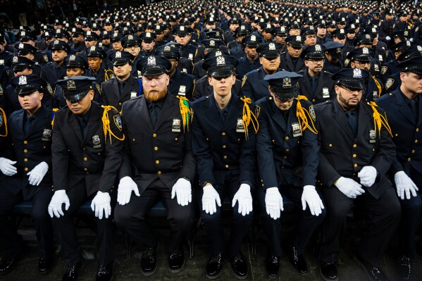 New York City Police Academy graduates attend an NYPD graduation ceremony held at Madison Square Garden in New York on Monday, March 9, 2026. (AP Photo/Angelina Katsanis)
