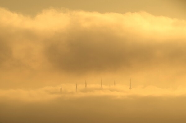 Morning fog engulfs the Camlica Mosque during the Muslim holy fasting month of Ramadan as the sun rises in Istanbul, Turkey, Tuesday, March 10, 2026. (AP Photo/Francisco Seco)