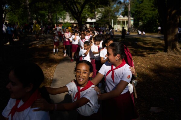 Children play during a school activity in a park in Havana, Cuba, Tuesday, March 10, 2026. (AP Photo/Ramon Espinosa)