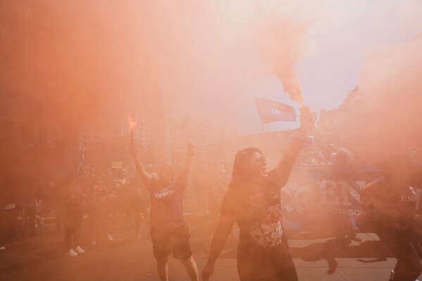 Women take part in an International Women's Day protest in Santiago, Chile, Sunday, March 8, 2026. (AP Photo/Esteban Felix)