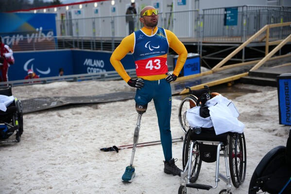 Robelson Lula of Brazil reacts after competing in the cross country skiing men's 10 kilometer interval start sitting final at the 2026 Winter Paralympics, in Tesero, Italy, Wednesday, March 11, 2026. (AP Photo/Emilio Morenatti)