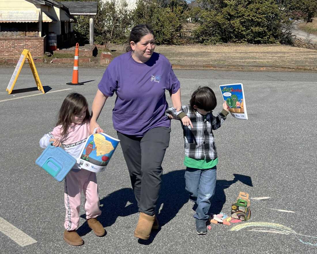 Tracy Hobbes brought her 5-year-old twins to a mobile clinic to get their measles, mumps and rubella vaccines. She was reluctant to vaccinate her kids because of misinformation, but changed her mind. The measles isn't something to play with, Hobbes said.