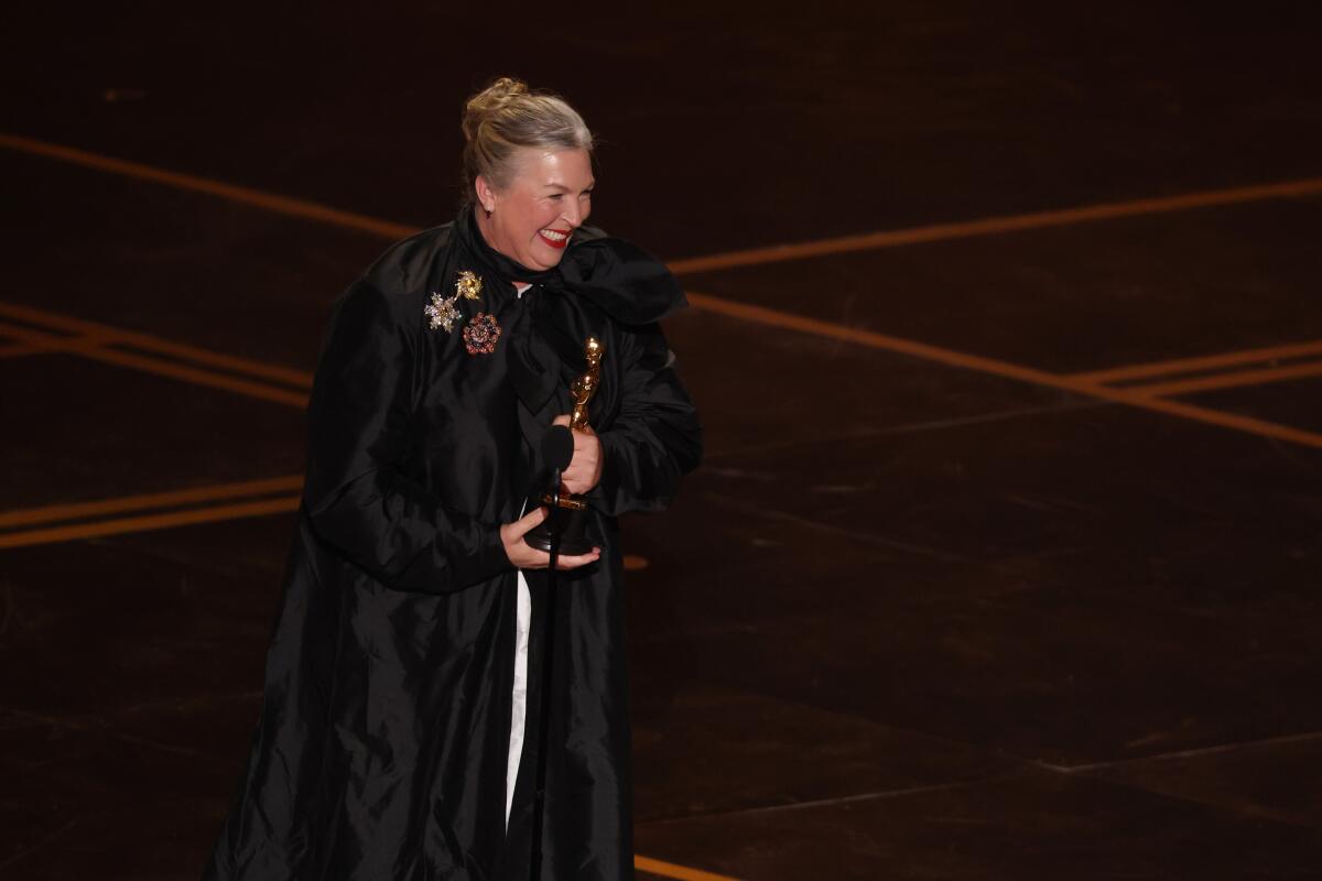 Kate Hawley accepts the costume design Oscar for "Frankenstein" during the 98th Academy Awards.