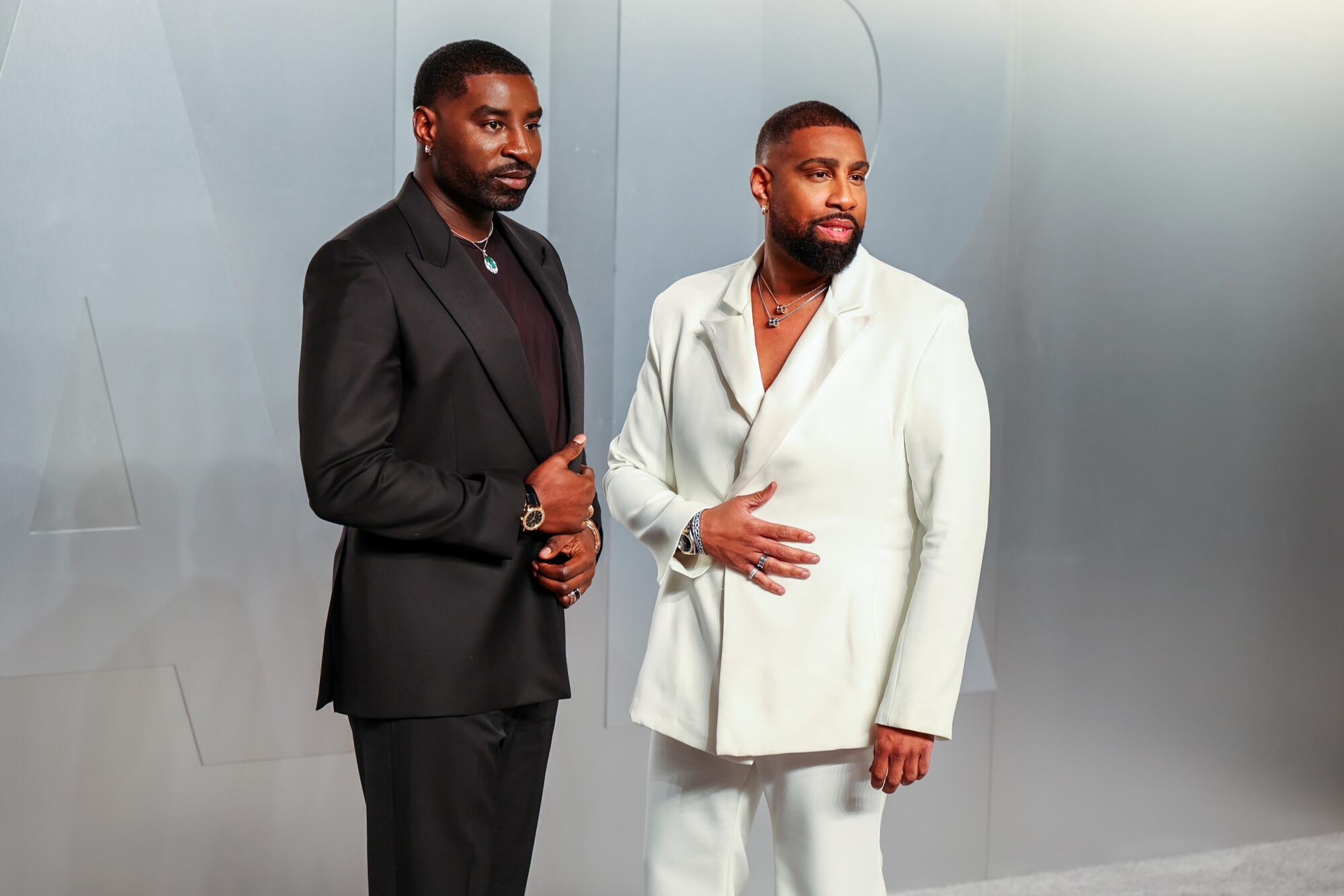 Wayman Bannerman and Micah McDonald pose on the red carpet. 