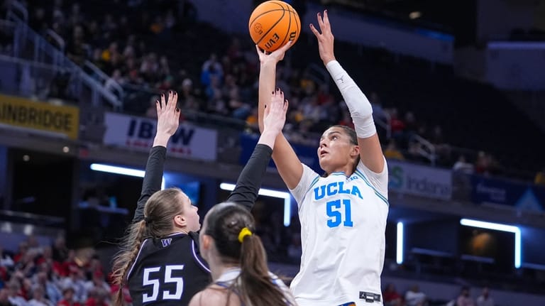 UCLA center Lauren Betts (51) shoots over Washington center Yulia...
