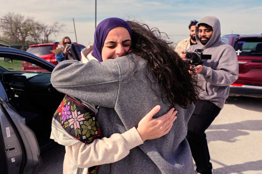 Leqaa Kordia, left, embraces friends, family and suppporters after being released from the Prairieland Detention Center in Alvarado, Texas, Monday, March 16, 2026.