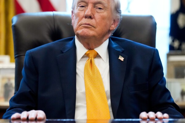 President Donald Trump pauses after signing an executive order in the Oval Office of the White House, Monday, March 16, 2026, in Washington. (AP Photo/Julia Demaree Nikhinson)