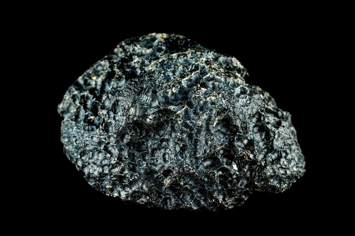 close up of gemstone against black background