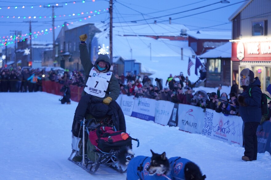 2026 Iditarod Trail Sled Dog Race champion Jessie Holmes arrives at the 1,000-mile race's finish line in Nome the evening of Tuesday, March 17, 2026.