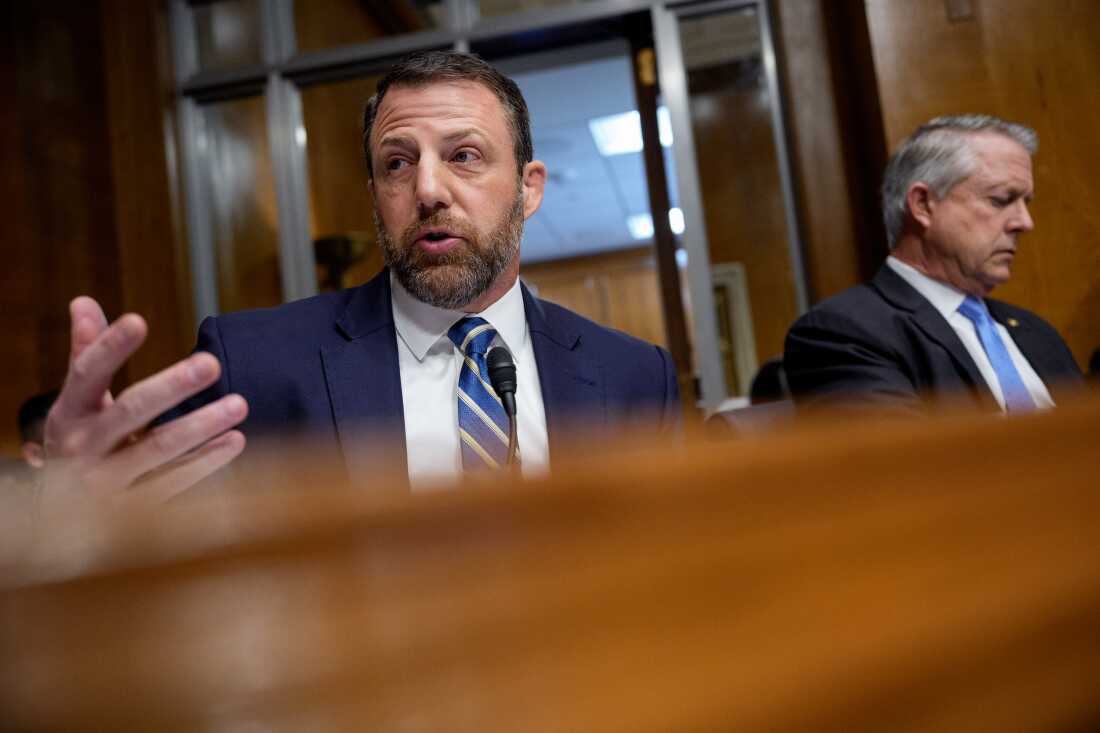 Sen. Markwayne Mullin, R-Okla., (left), speaks during a Senate Health, Education, Labor and Pensions Committee nomination hearing last month. At the hearing, Dr. Casey Means, a health influencer, made her case to be the next surgeon general.