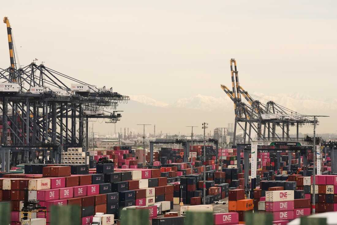 Containers are stacked at the Port of Los Angeles Friday, Feb. 20, 2026, in Los Angeles.