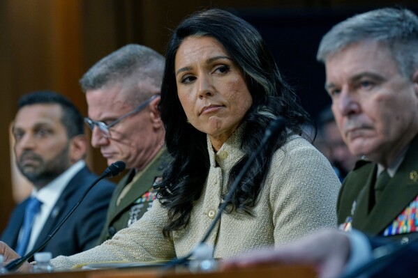 From left, FBI Director Kash Patel, Defense Intelligence Agency Director James Adams III, Director of National Intelligence Tulsi Gabbard, and Acting Commander of the U.S. Cyber Command William Hartman, listen during the Senate Committee on Intelligence hearings to examine worldwide threats on Capitol Hill Wednesday, March 18, 2026, in Washington. (AP Photo/Jose Luis Magana)