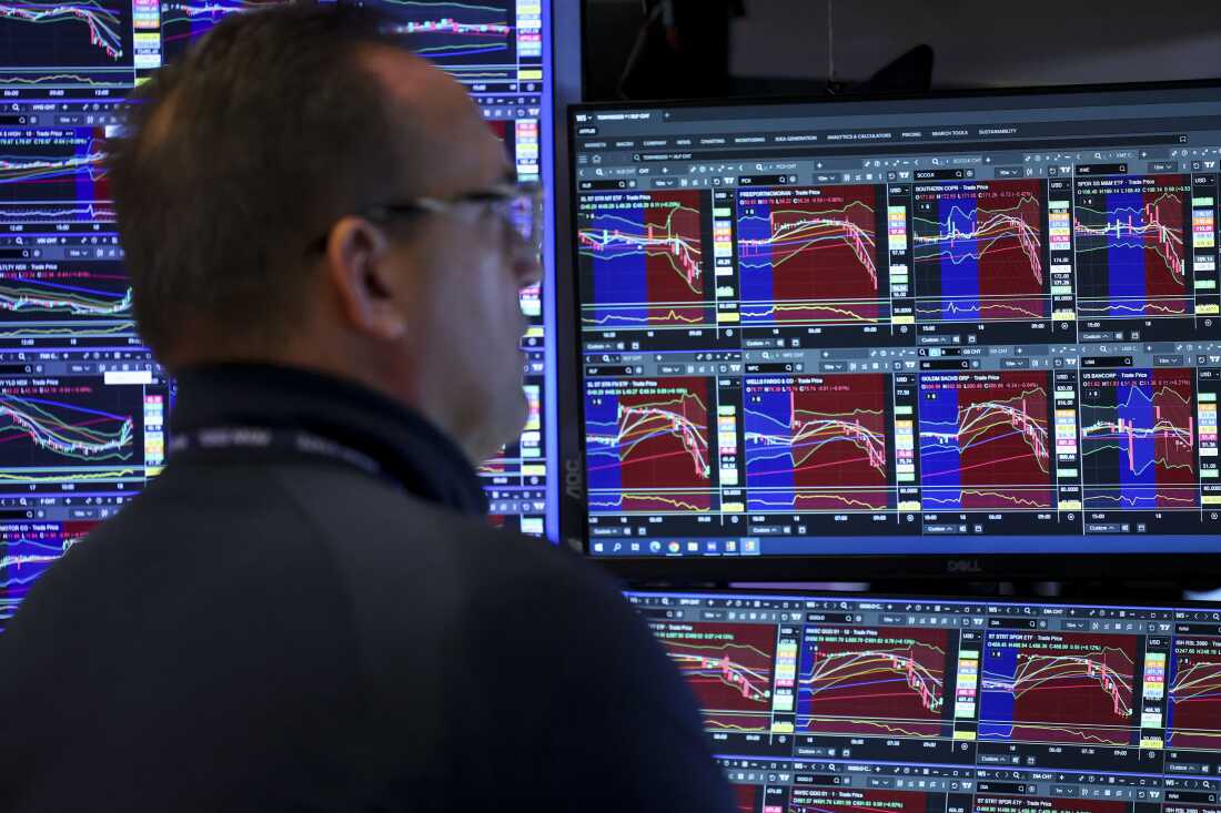 A trader works on the floor of the New York Stock Exchange (NYSE) at the opening bell in New York on March 18, 2026.