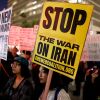 Demonstrators protest outside City Hall in Los Angeles on March 2 against the U.S. and Israel's attack on Iran.