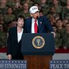 Japanese Prime Minister Sanae Takaichi (R) listens as U.S. President Donald Trump (L) speaks to troops aboard USS George Washington on October 28, 2025 in Yokosuka, Japan.