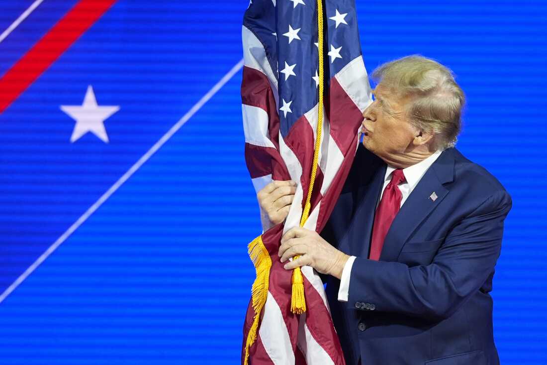 Before he was elected to a second term, former President Donald Trump hugged and kissed the U.S. flag as he spoke at the Conservative Political Action Conference at National Harbor, in Oxon Hill, Md., in 2024.