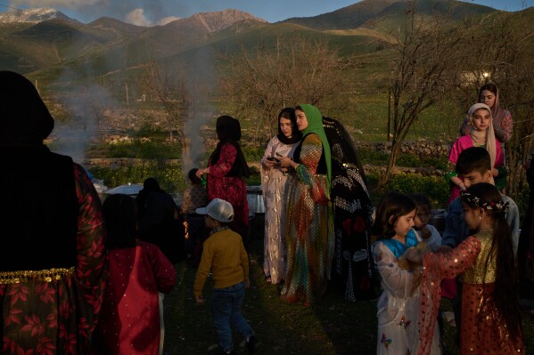 Women take part in a family gathering to break their fast with an Iftar meal during the Muslim holy month of Ramadan in the village of Gulp, Iraq, Tuesday, March 17, 2026. (AP Photo/Leo Correa)