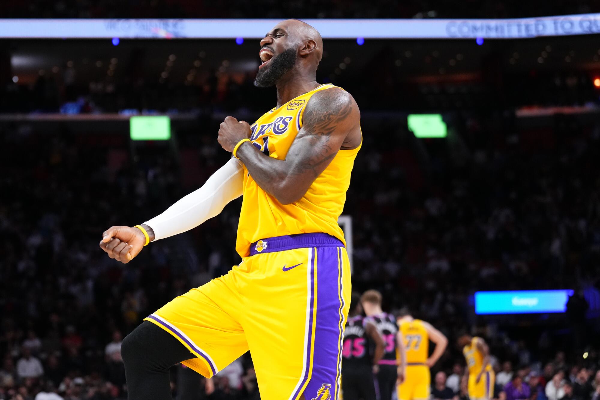 Lakers star LeBron James celebrates during the fourth quarter against the Miami Heat on Thursday.