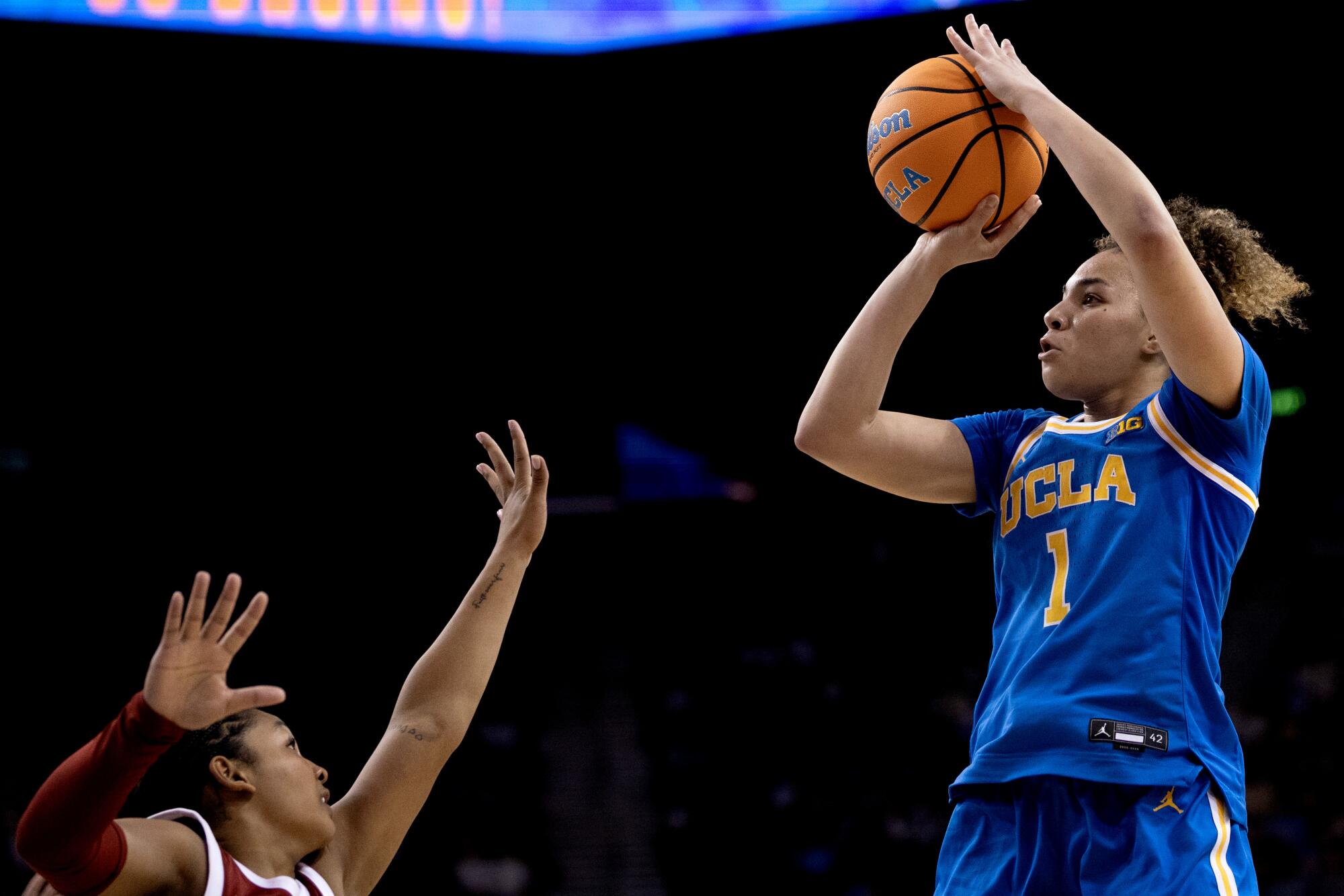 UCLA guard Kiki Rice shoots over USC guard Malia Samuels at Pauley Pavilion on Jan. 3.