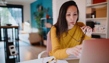 Middle aged woman working from home office.