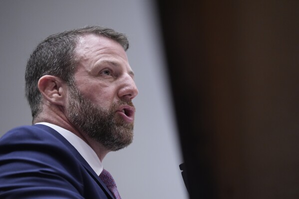 Sen. Markwayne Mullin, R-Okla., President Donald Trump's pick for Homeland Security secretary, testifies during Senate Committee on Homeland Security and Governmental Affairs hearing, Wednesday, March 18, 2026 on Capitol Hill in Washington. (AP Photo/Manuel Balce Ceneta)