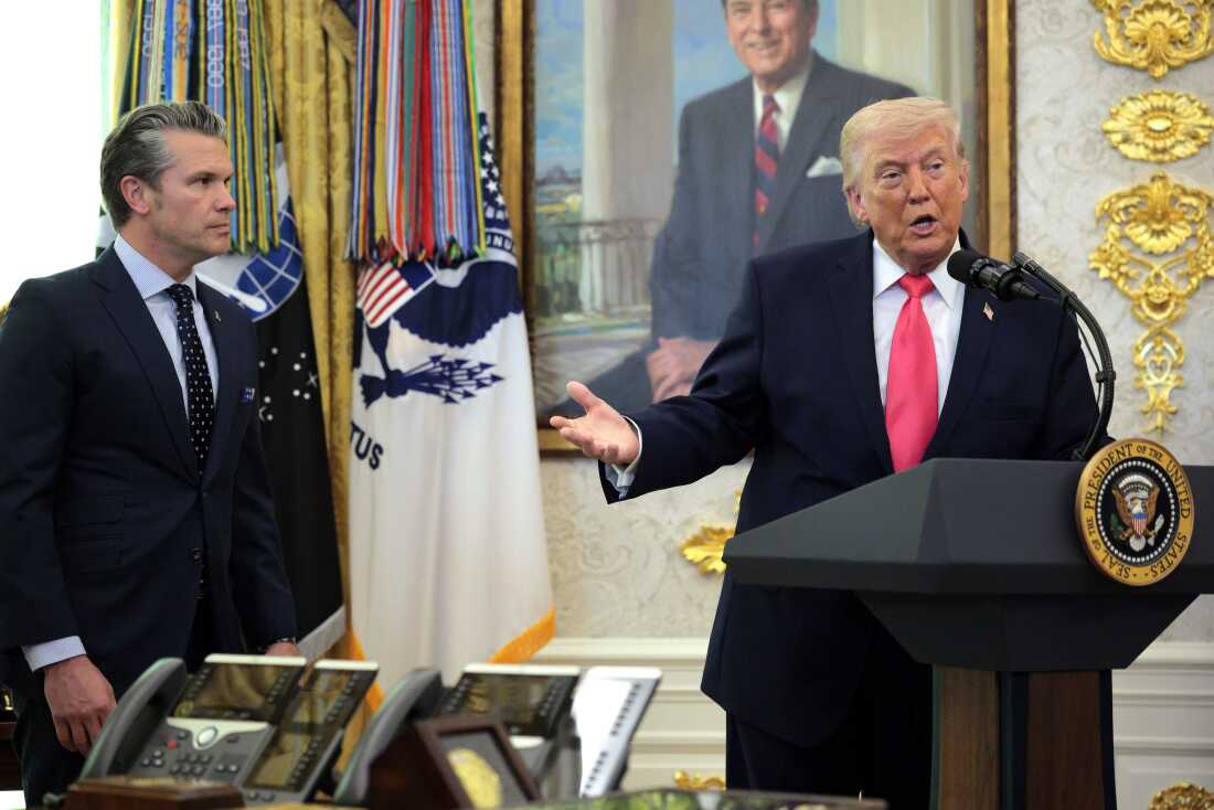 President Trump takes questions as Defense Secretary Pete Hegseth (left) looks on during a ceremony for Markwayne Mullin, the newly sworn-in secretary for the Department of Homeland Security, in the Oval Office at the White House in Washington, D.C., on Tuesday.