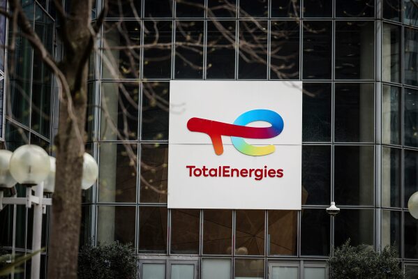 A sign for French company TotalEnergies is displayed March 21, 2025, in La Defense business district outside Paris. (AP Photo/Thomas Padilla, File)
