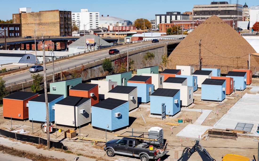 Tiny, colorful cabins in Home Sweet Home Ministries’ shelter village, The Bridge, while the complex was under construction. The shelter village is in Bloomington, Illinois and houses up to 56 adults.