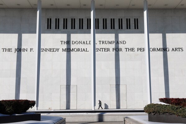 A woman walks outside The John F. Kennedy Memorial Center For The Performing Arts on Feb. 2, 2026, in Washington. (AP Photo/Rahmat Gul, File)