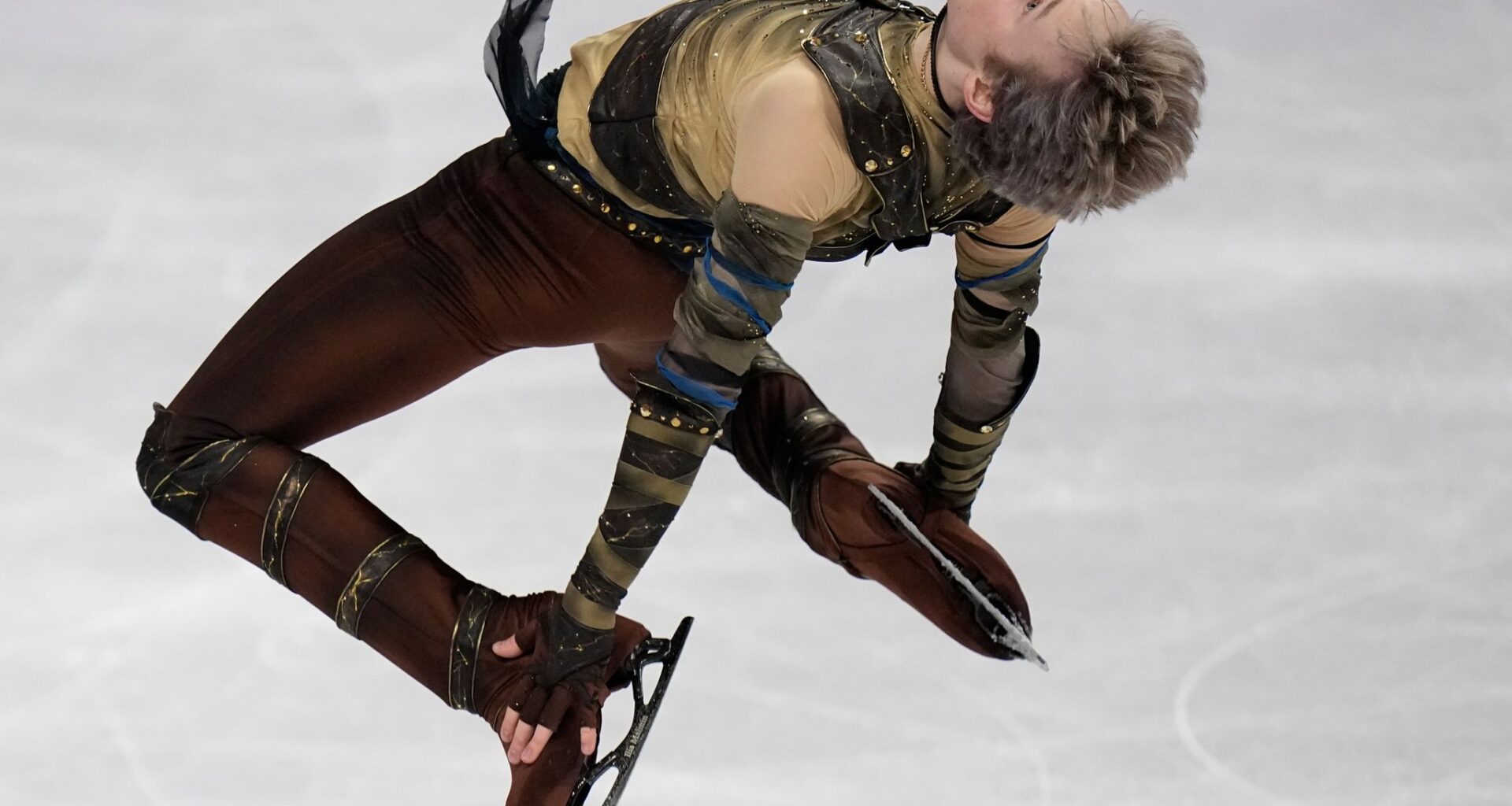 Malinin rebounds from Olympics at the worlds with a personal-best short program