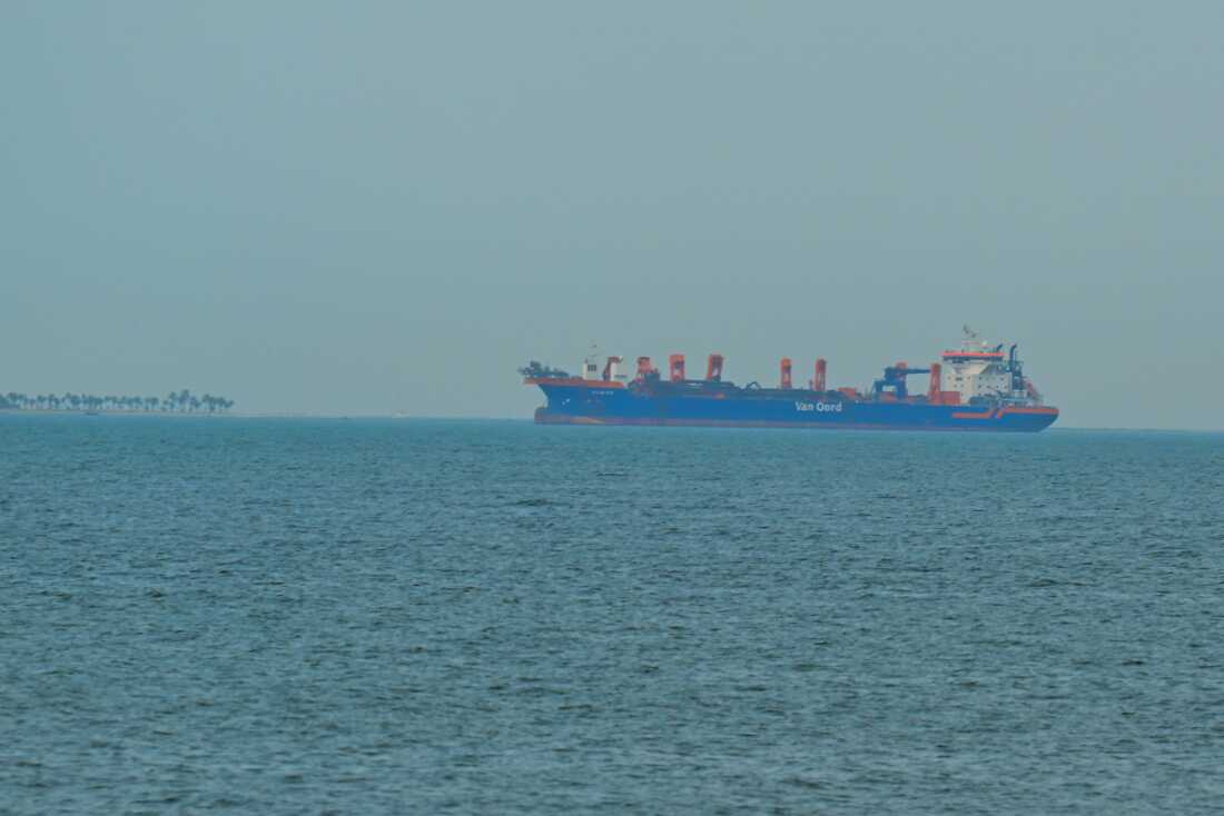 A commercial ship is anchored off the coast of the United Arab Emirates, on March 2.