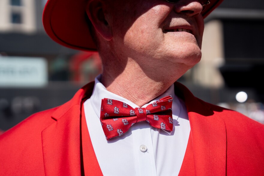 Ike Watson, of Burlington, Ia., sports a St. Louis Cardinals bow tie during MLB Opening Day festivities on Thursday, March 26, 2026, in downtown St. Louis.