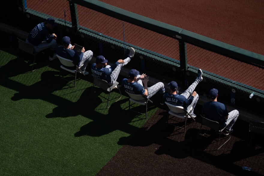 Tampa Bay Rays players watch the team take on the St. Louis Cardinals during MLB Opening Day at Busch Stadium on Thursday, March 26, 2026, in downtown St. Louis.