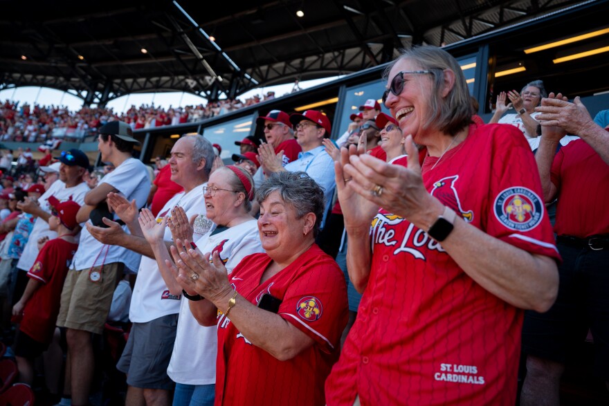 Lisa Schrock, of Kirkwood, right, and Marcy Rodriguez, second from right, cheer as the St. Louis Cardinals are introduced before taking on the Tampa Bay Rays during MLB Opening Day at Busch Stadiumon Thursday, March 26, 2026, in downtown St. Louis.