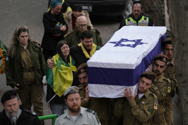 Israeli soldiers carry the flag-draped casket of Staff Sgt. Ori Greenberg who was killed in combat in Lebanon, during his funeral at Mount Herzl military cemetery in Jerusalem Thursday, March 26, 2026. (AP Photo/Mahmoud Illean)