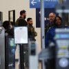 Immigration and Customs Enforcement agents work at the baggage check and security control x-ray area at O'Hare International Airport in Chicago on Tuesday.