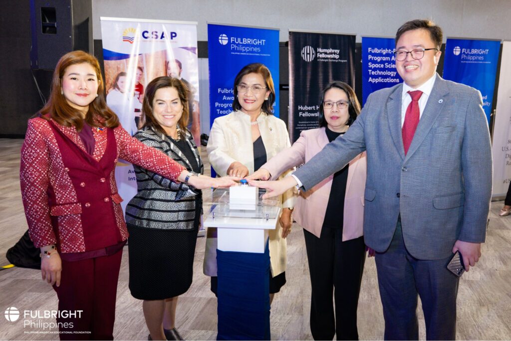U.S. Embassy Counselor for Public Affairs Jessica Simon, Philippine-American Educational Foundation Executive Director Julio Amador, and representatives of partner institutions pressing a button. 