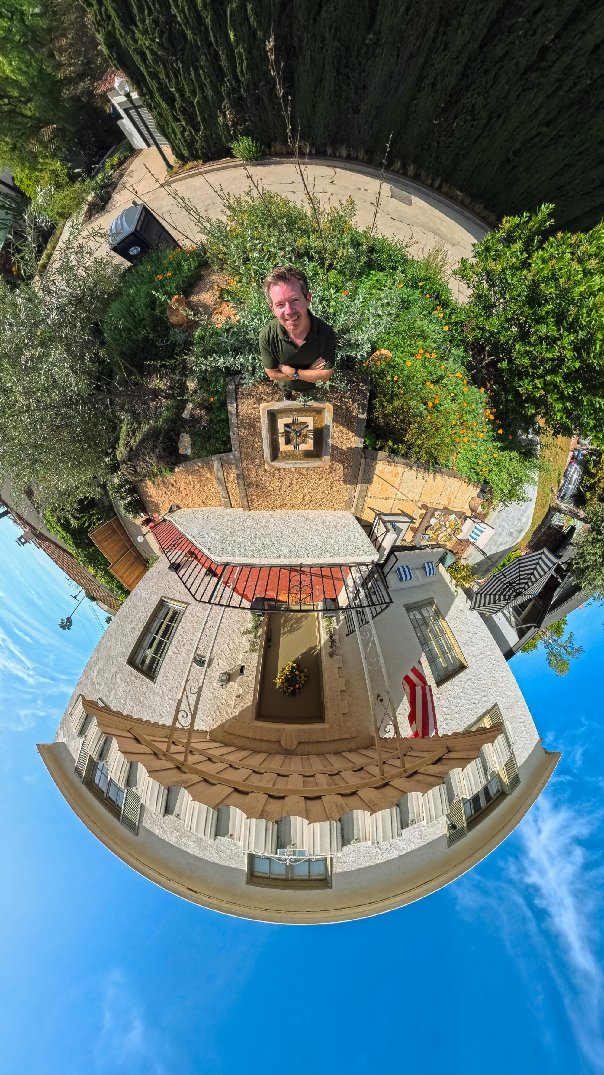 Smee is backed by white sage in a "Tiny Planet"-style photo.