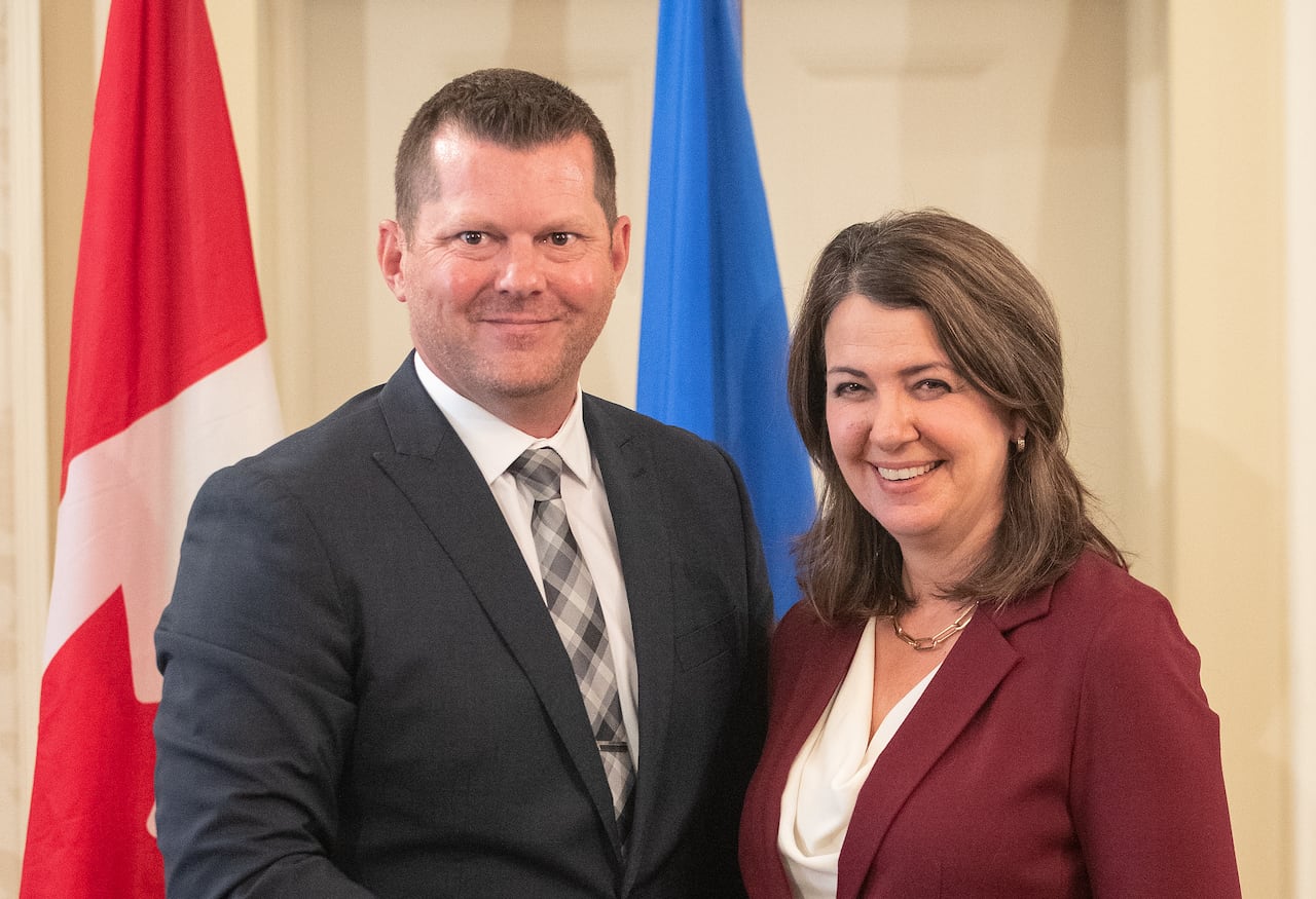 Alberta Premier Danielle Smith and Agriculture and Irrigation Minister RJ Sigurdson stand together during the swearing in of her cabinet, in Edmonton, Friday, June 9, 2023. THE CANADIAN PRESS/Jason Franson.