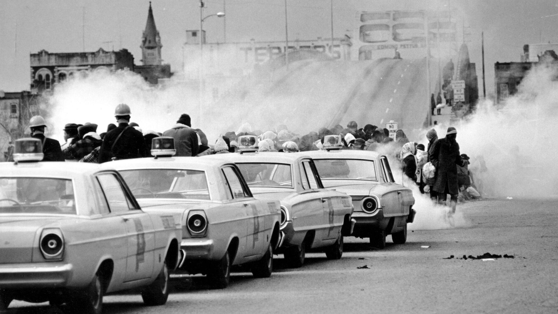 Tear gas fills the air as state troopers, ordered by Gov. George Wallace, break up a march at the Edmund Pettus Bridge in Selma, Ala., on Sunday, March 7, 1965.