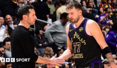 Luka Doncic of the Los Angeles Lakers shakes hands with head coach JJ Redick during a game against the Atlanta Hawks in January 2026