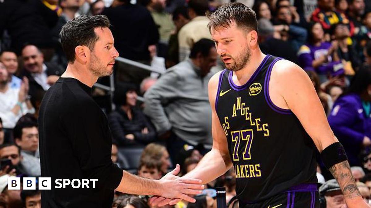 Luka Doncic of the Los Angeles Lakers shakes hands with head coach JJ Redick during a game against the Atlanta Hawks in January 2026