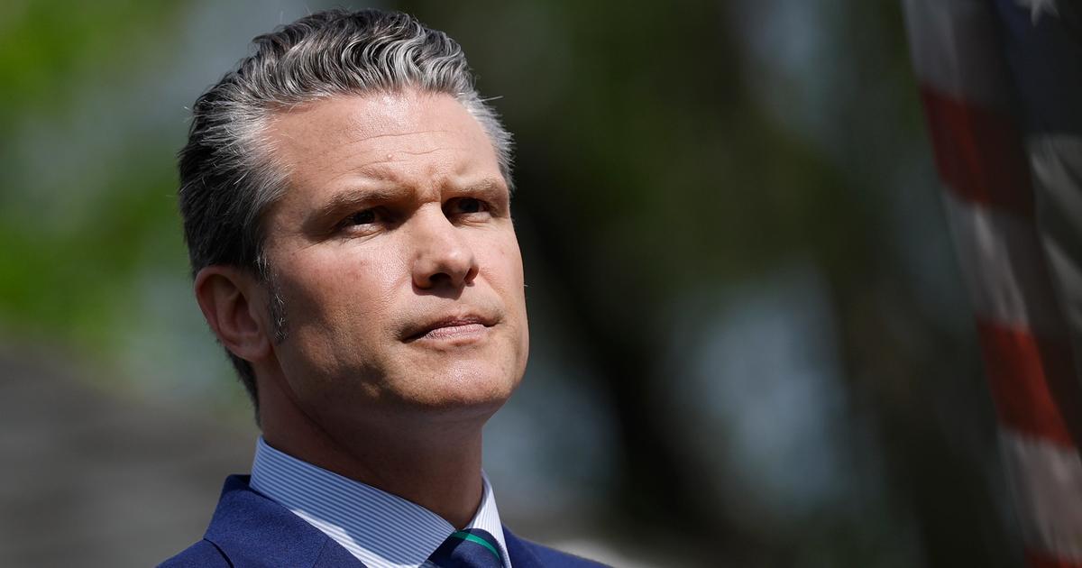 Behind the US' commander-in-chief Pete Hegseth