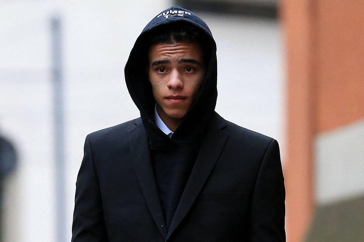 England and Manchester United footballer Mason Greenwood leaves Minshull Street Crown Court in Manchester on November 21, 2022 after a preliminary hearing on charges of attempted rape, controlling and coercive behaviour, and assault. - The 21-year-old was first arrested in January over allegations relating to a young woman after images and videos were posted online. All three charges relate to the same complainant