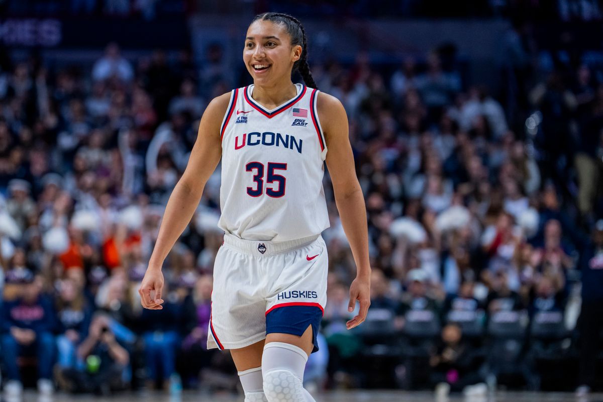 Azzi Fudd of the Connecticut Huskies smiles