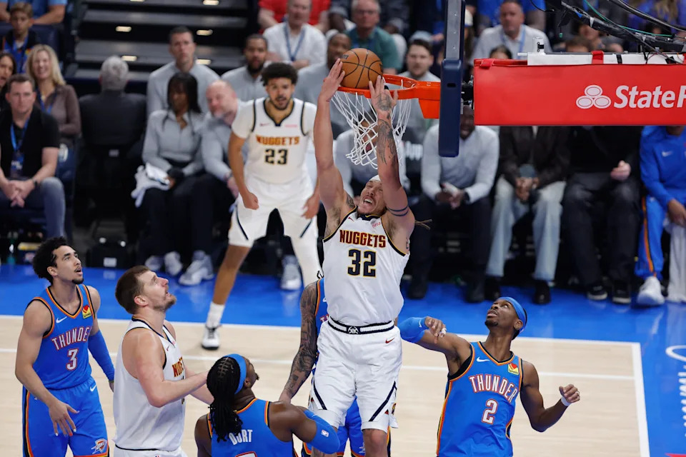 Mar 9, 2026; Oklahoma City, Oklahoma, USA; Denver Nuggets forward Aaron Gordon (32) dunks against the Oklahoma City Thunder during the first quarter at Paycom Center. Mandatory Credit: Alonzo Adams-Imagn Images