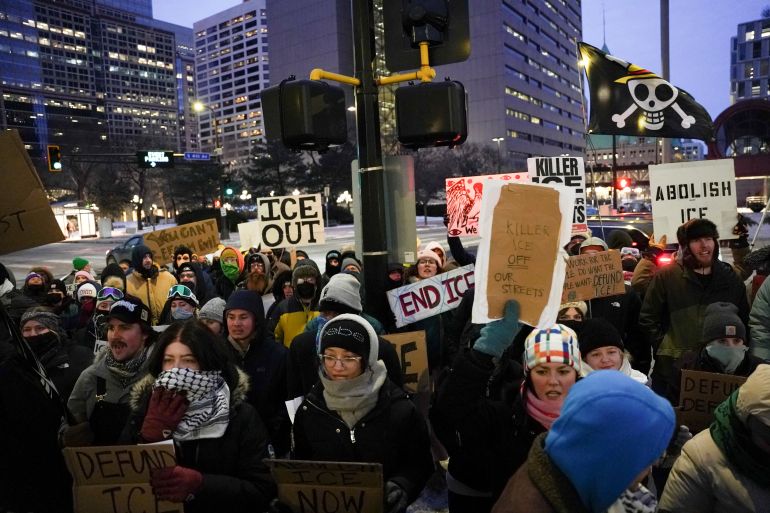 People protest against immigration enforcement actions during a rally outside US Senator Amy Klobuchar's office in Minneapolis, Minnesota