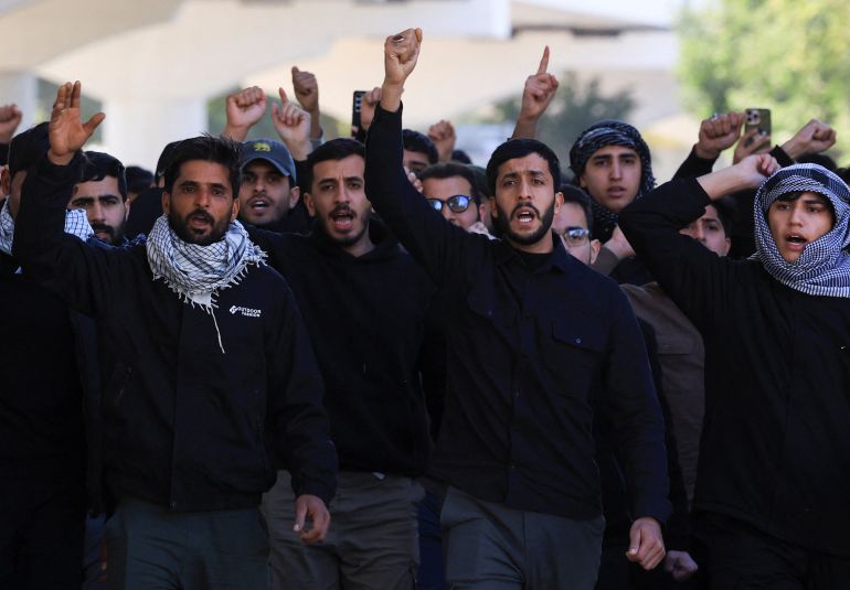 Supporters of Iraqi Shi'ite armed groups gather after the killing of Iran's Supreme Leader Ayatollah Ali Khamenei, in Baghdad