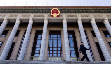 A man walks down the stairs at the entrance of the Great Hall of the People ahead of the annual National People's Congress...
